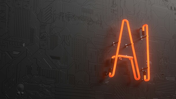 An organge neon sign that says AI hanging on a wall.
